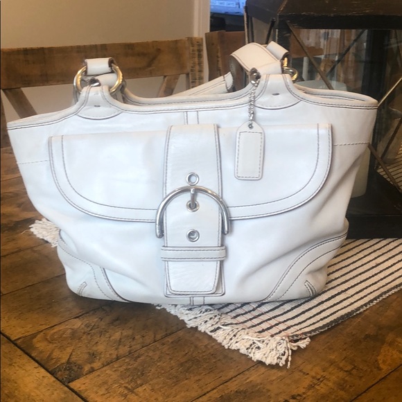 Coach leather hobo bag ivory with silver buckle.